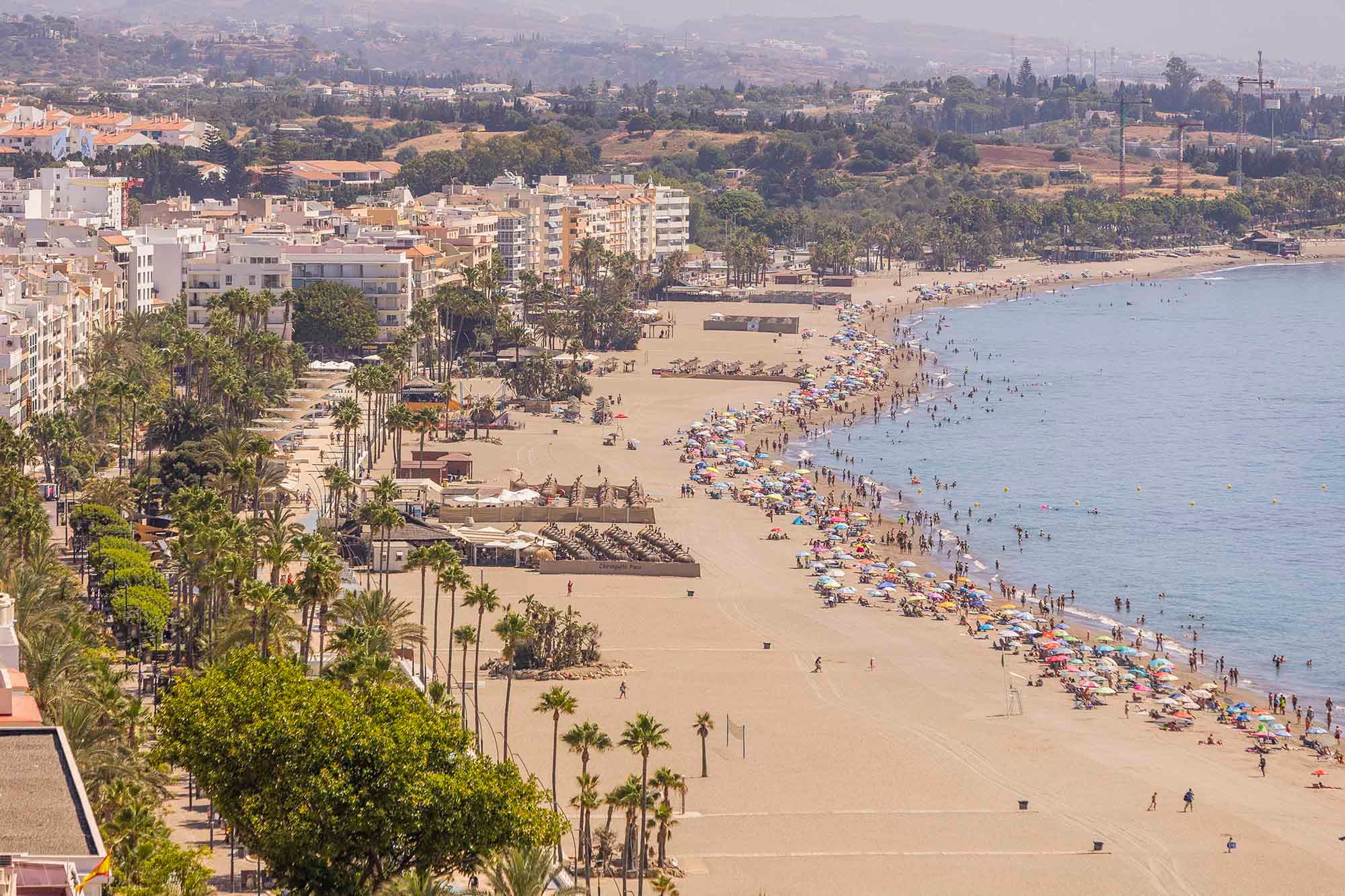 Aerial view of La Rada beach in Estepona during summer.