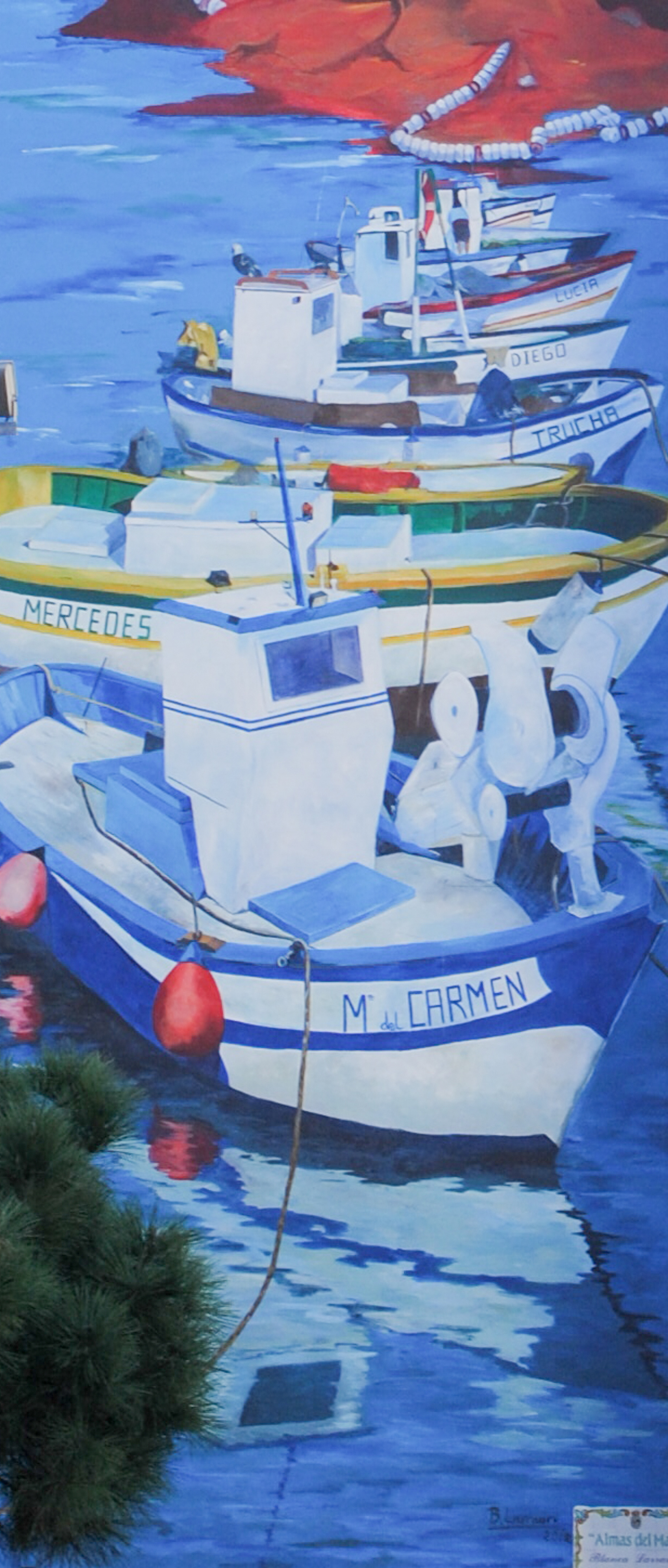 Large-format mural on a building facade in Estepona's old town